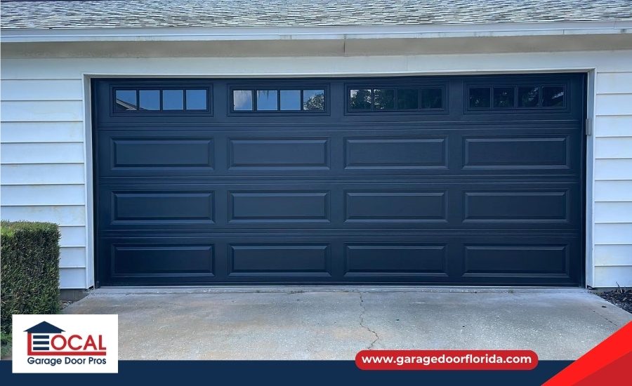 Modern black raised panel garage door with windows