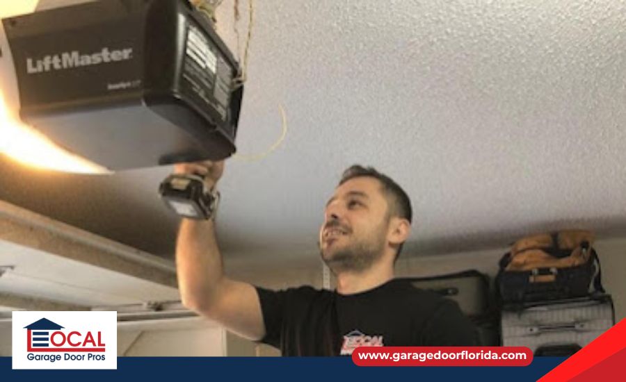 man inspecting garage door opener