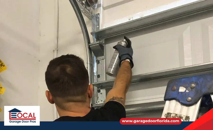 Applying silicone-based lubricant to a garage door track