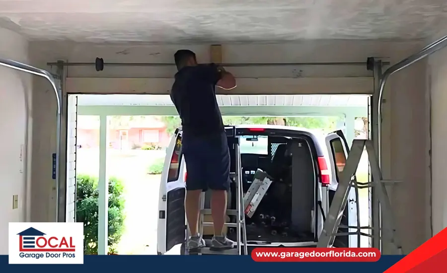 A technician inspecting garage door springs