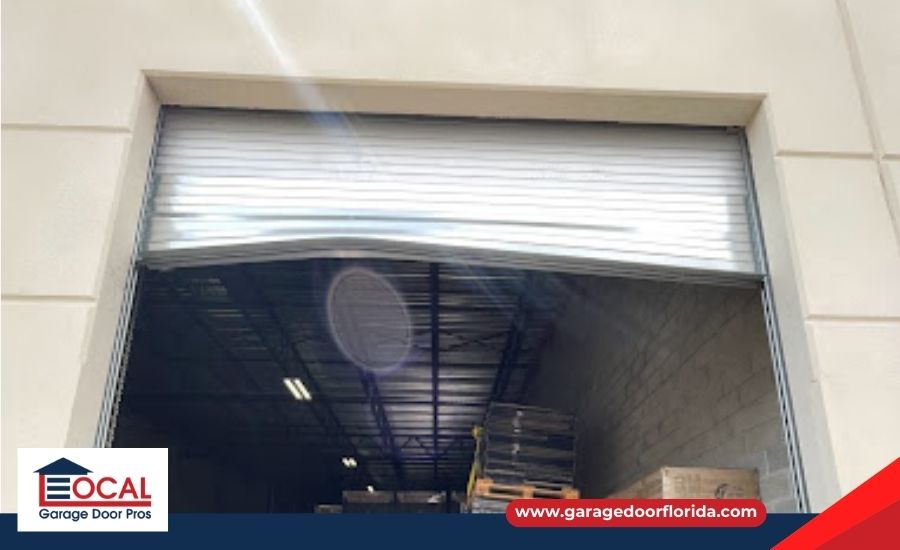 Uneven garage door due to broken cable.