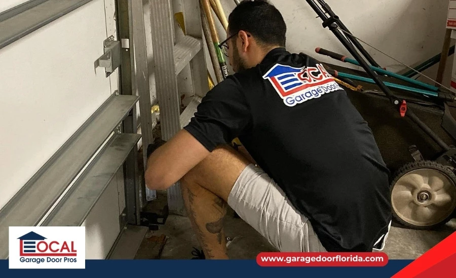 Technician inspecting a garage door safety reverse system in Lutz, FL