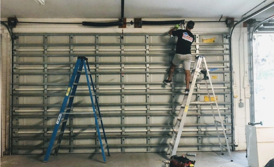 Commercial garage door repair in progress