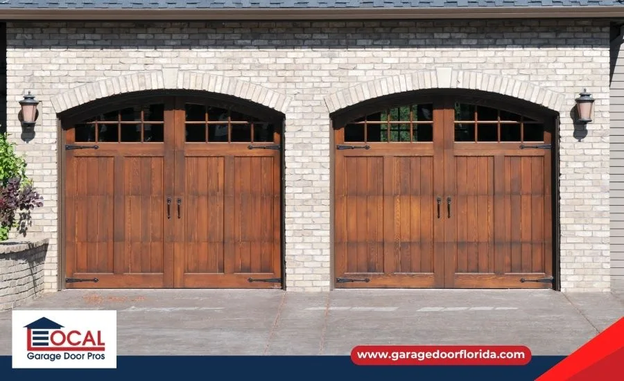 A beautiful Craftsman-style home featuring a perfectly paired carriage house garage door with faux-wood overlay