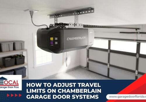 A modern garage door opener motor mounted to the ceiling of a clean residential garage.