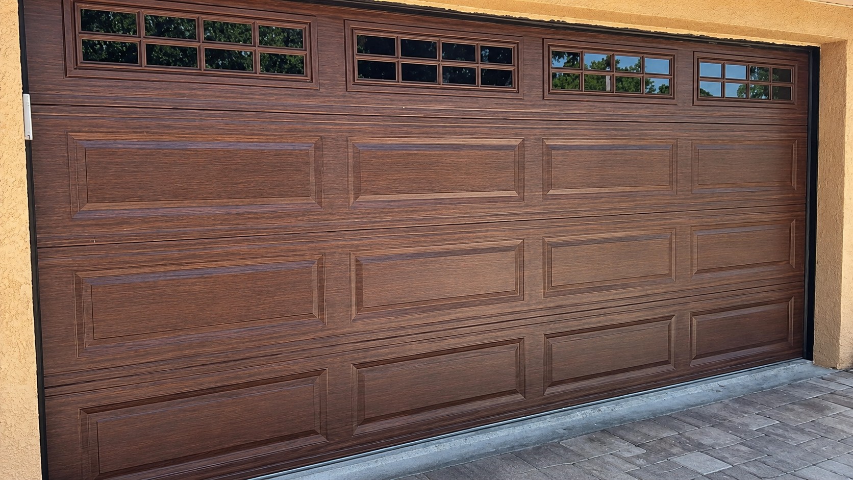 After: modern brown woodgrain garage door