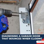 A gloved hand using a power drill on a metal garage door bracket, with text reading, "Diagnosing a garage door that bounces when closing."