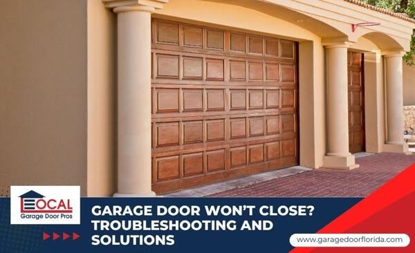 A homeowner looking concerned at a partially open residential garage door that is stuck and won't close.